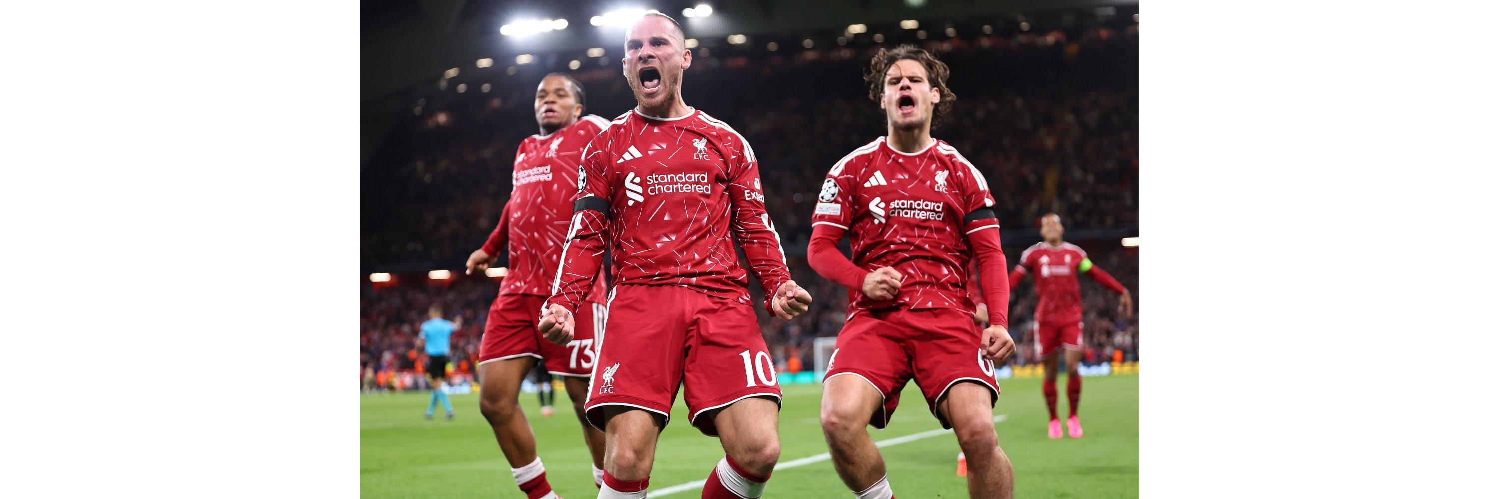 A liverpool football club player celebrating after scoring a goal in the champions league