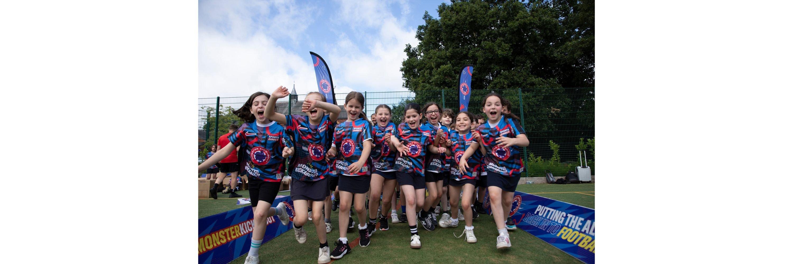 A picture of kids running towards the camera at a Monster Kickabout event
