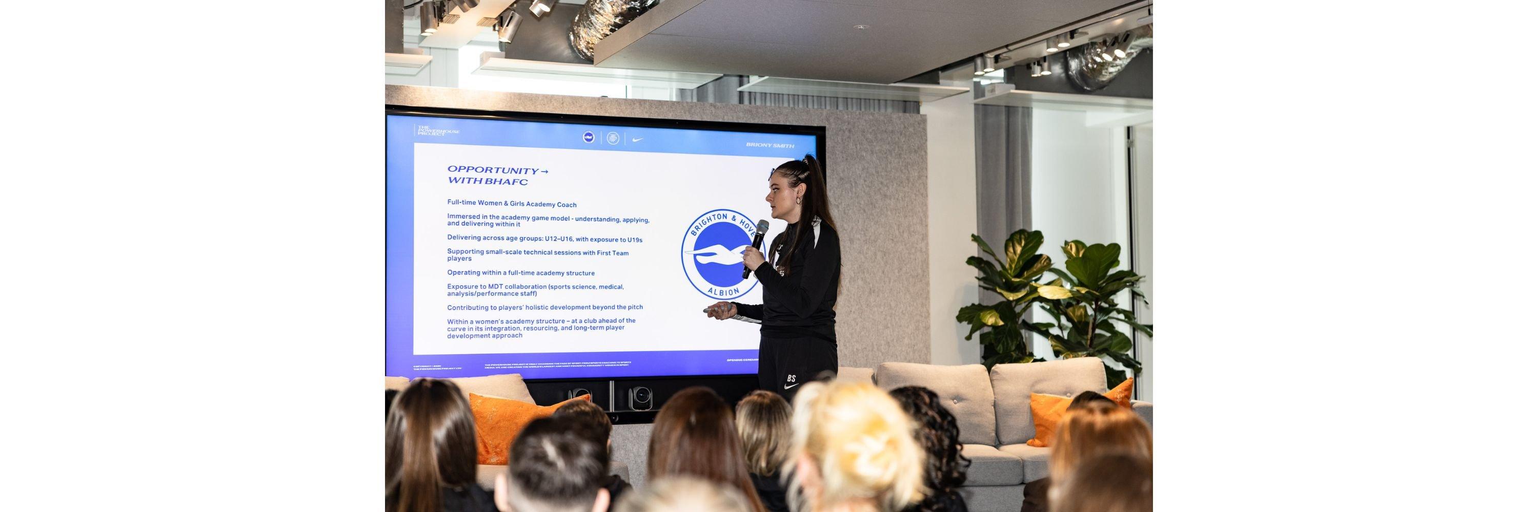 Briony Smith talking on stage about her Powerhouse Project journey