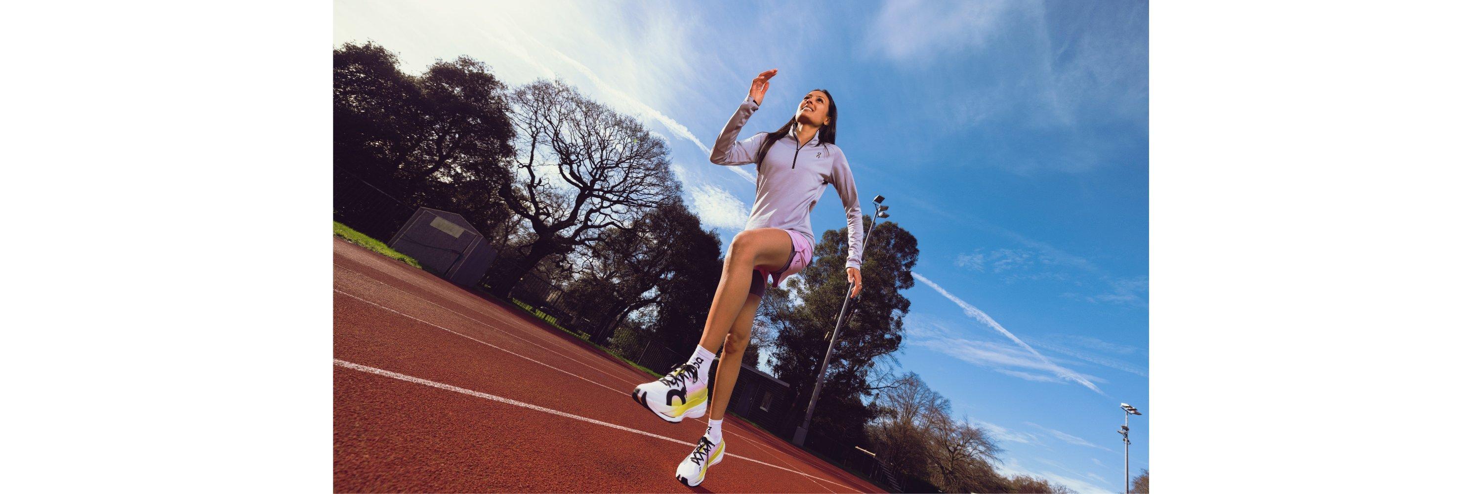 Women wearing running clothes running on a track 