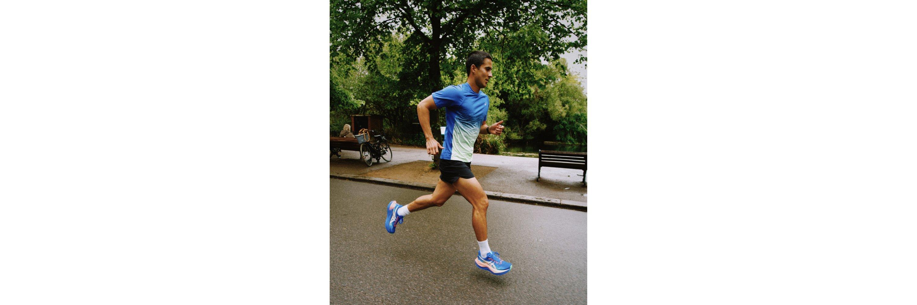 Man running in park wearing sports clothes and running trainers 