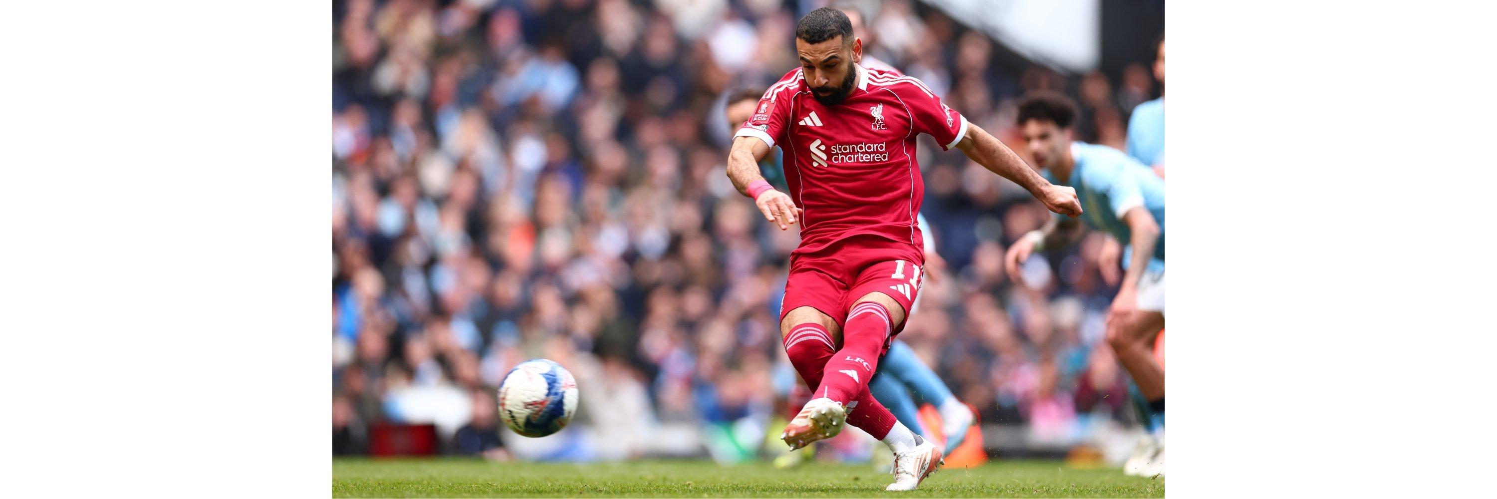 Mo Salah kicking a football