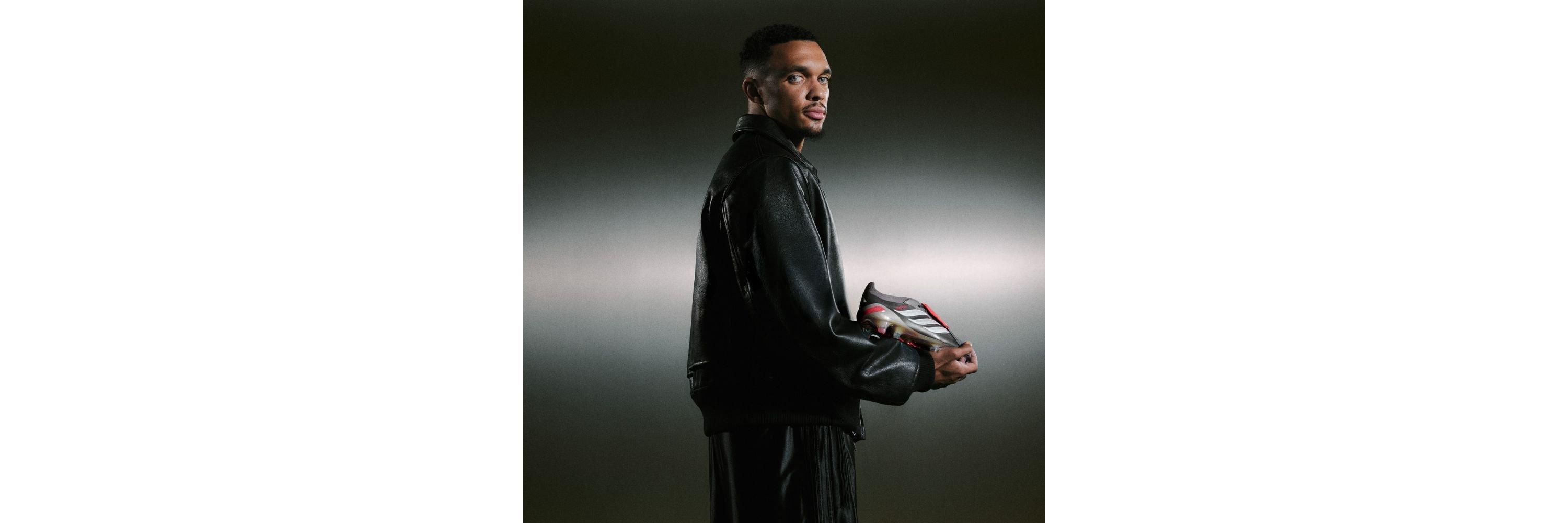 Trent Alexander-Arnold holding a pair of adidas Predators