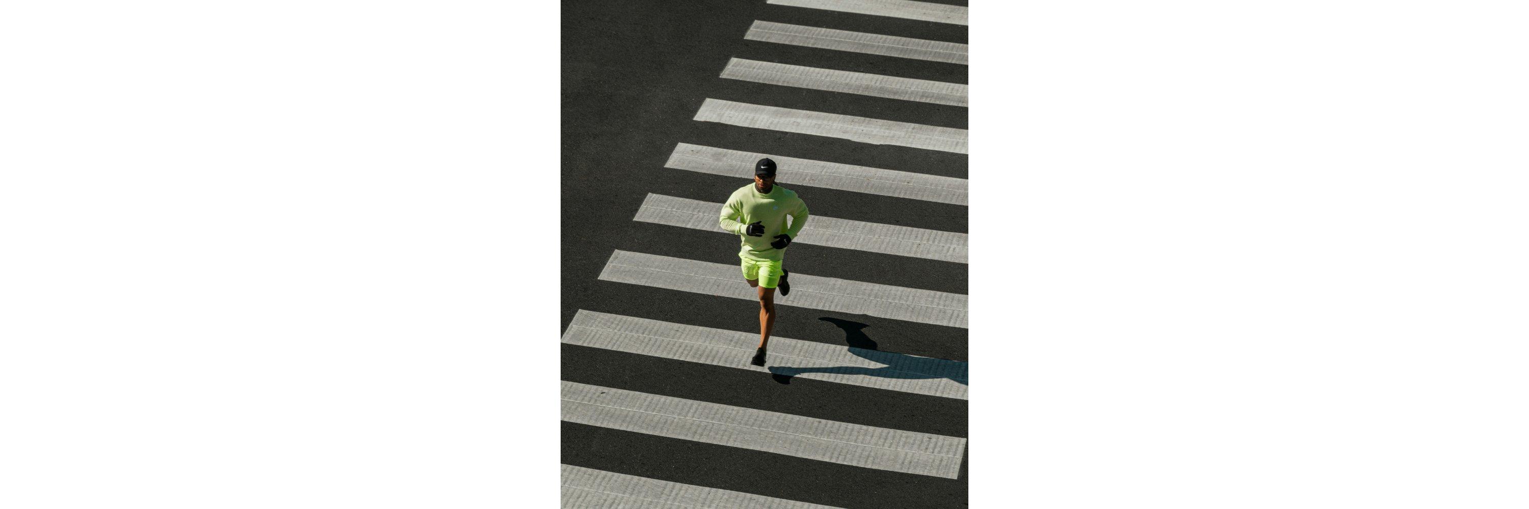 Two images side by side of a man wearing running gloves and clothes, stretching and warming up