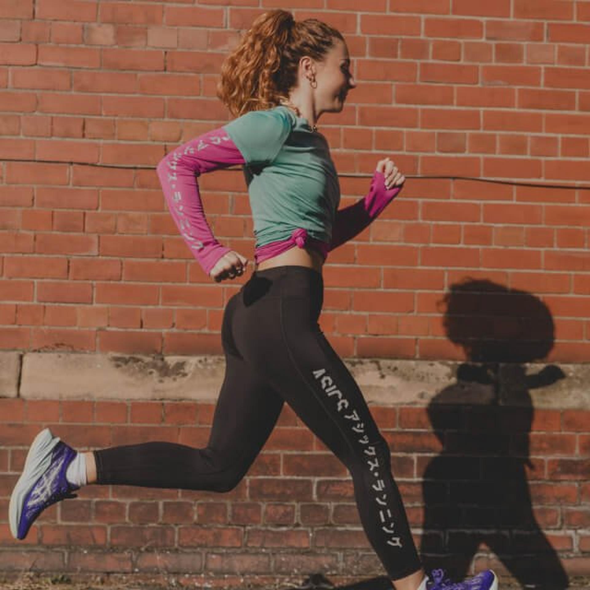 Woman running in Asics running gear