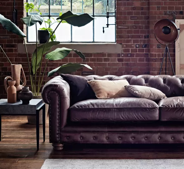 gray living room with brown leather furniture