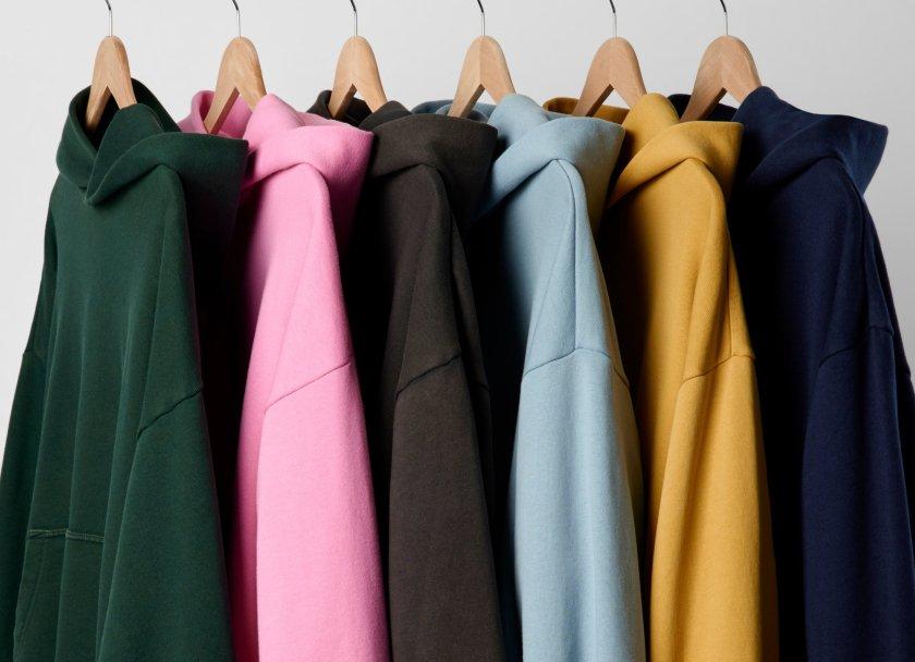 rack of multiple color sweatshirts