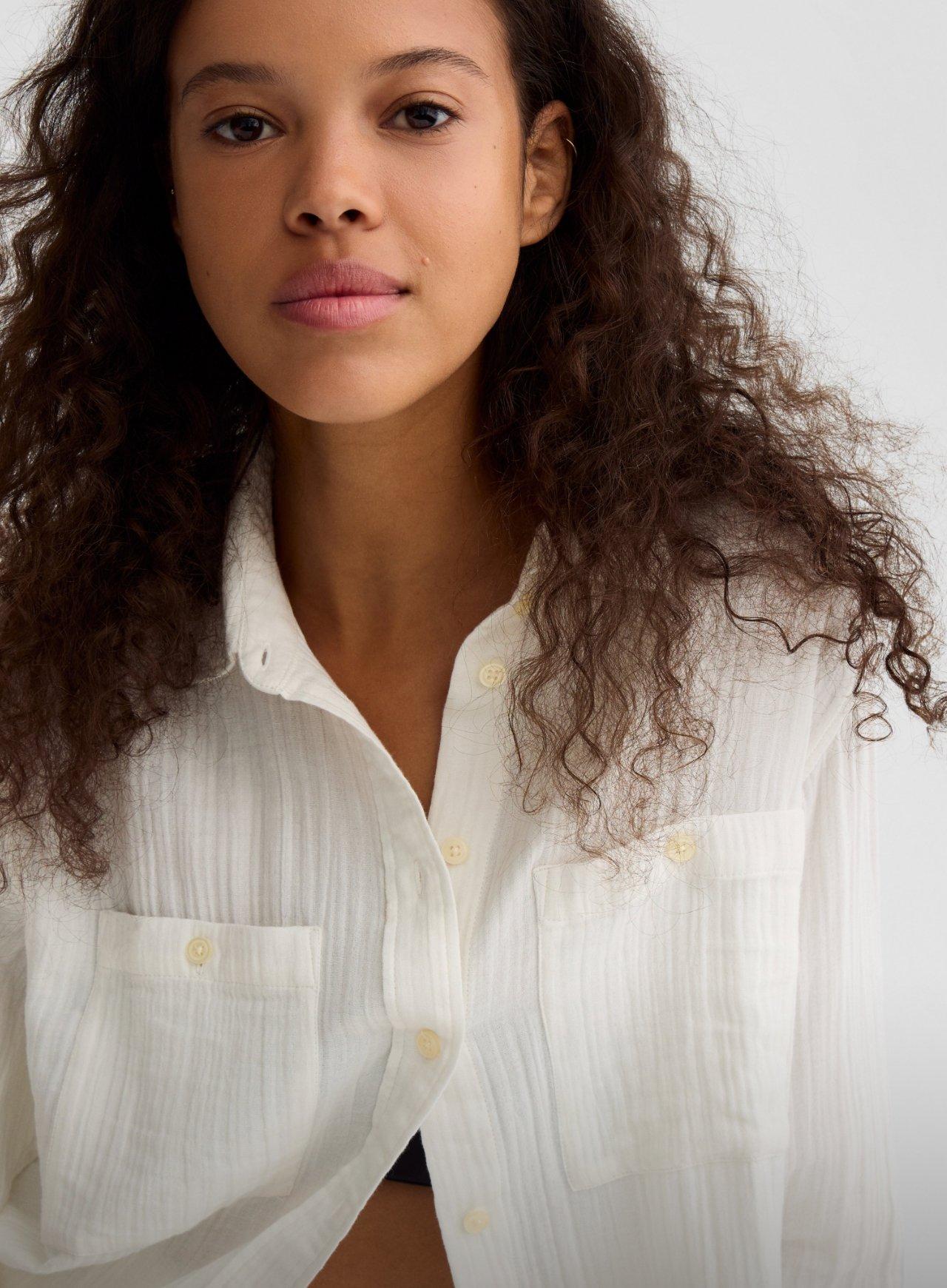 vertical portrait of young slim girls in denim shirt and shorts