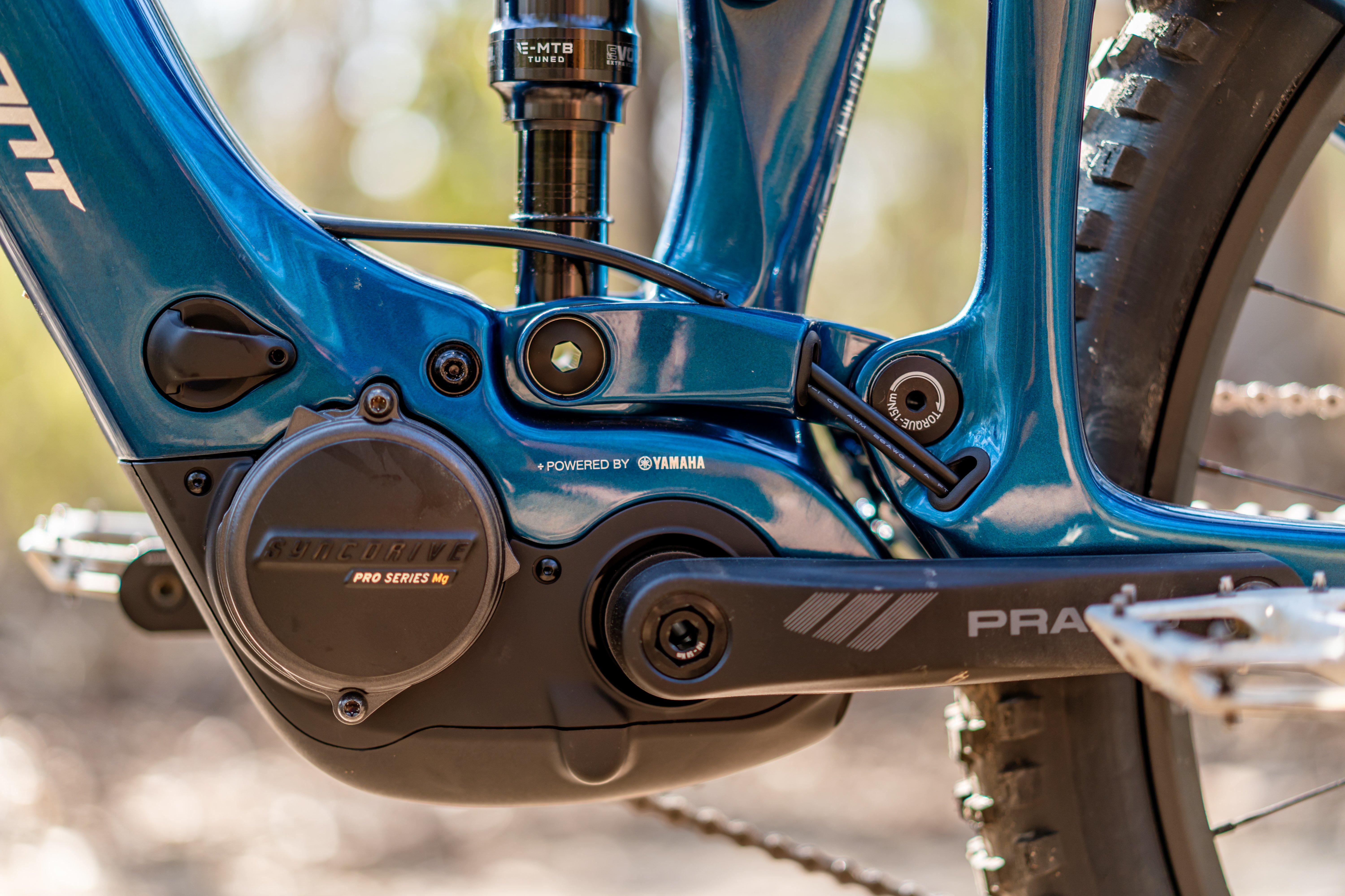 the front brake of a blue mountain bike