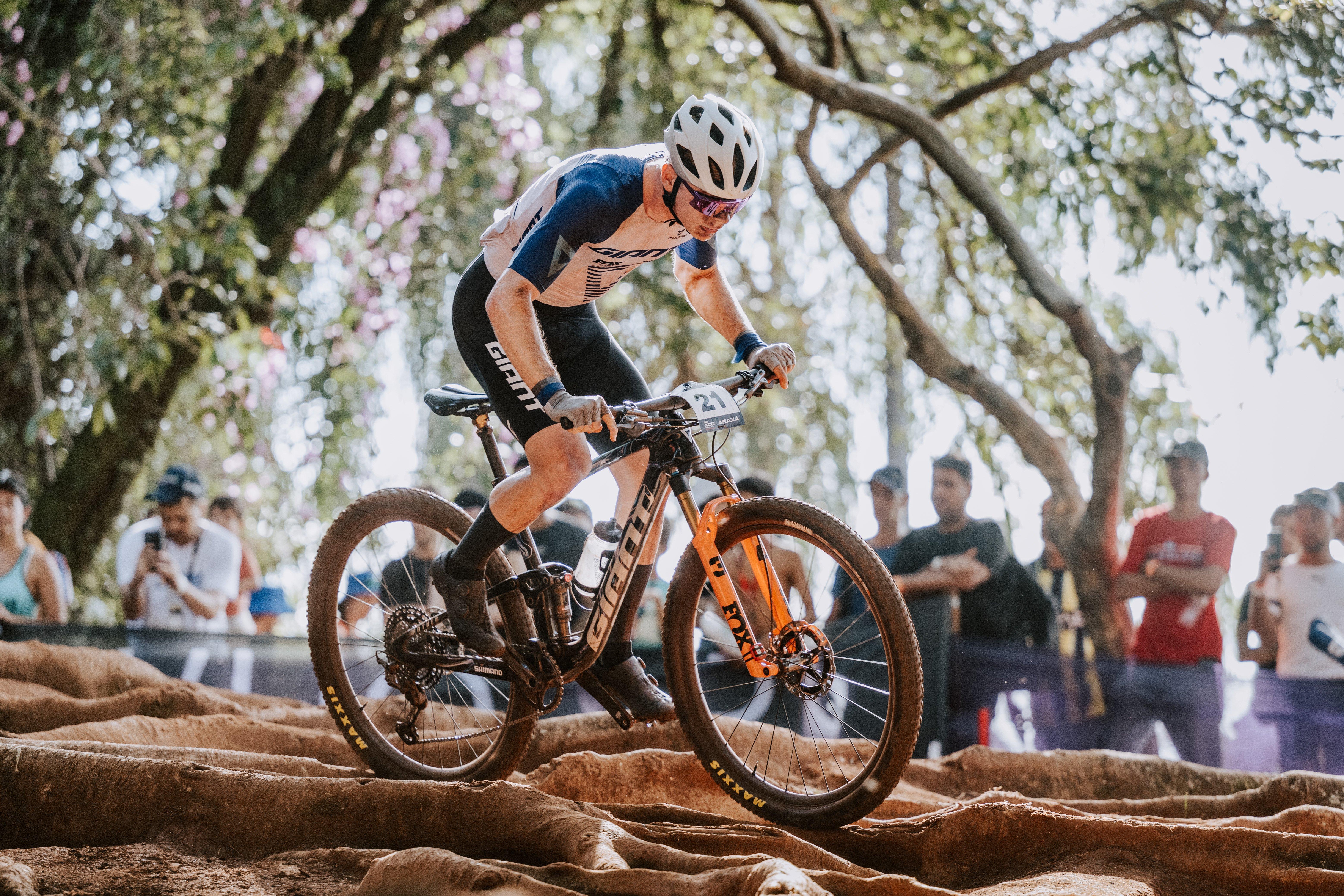 a man riding a mountain bike on a dirt track