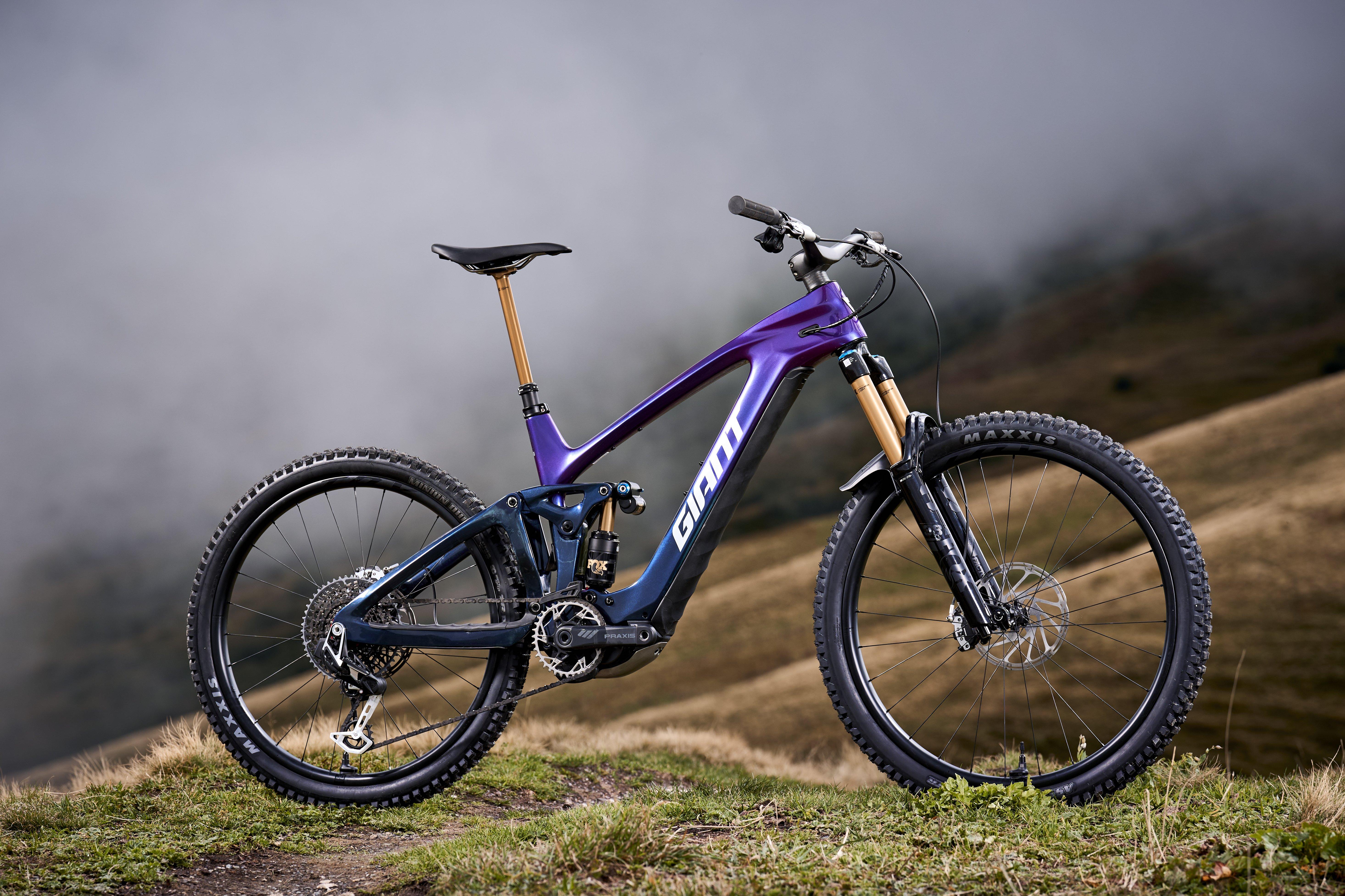 a mountain bike is parked on a dirt road