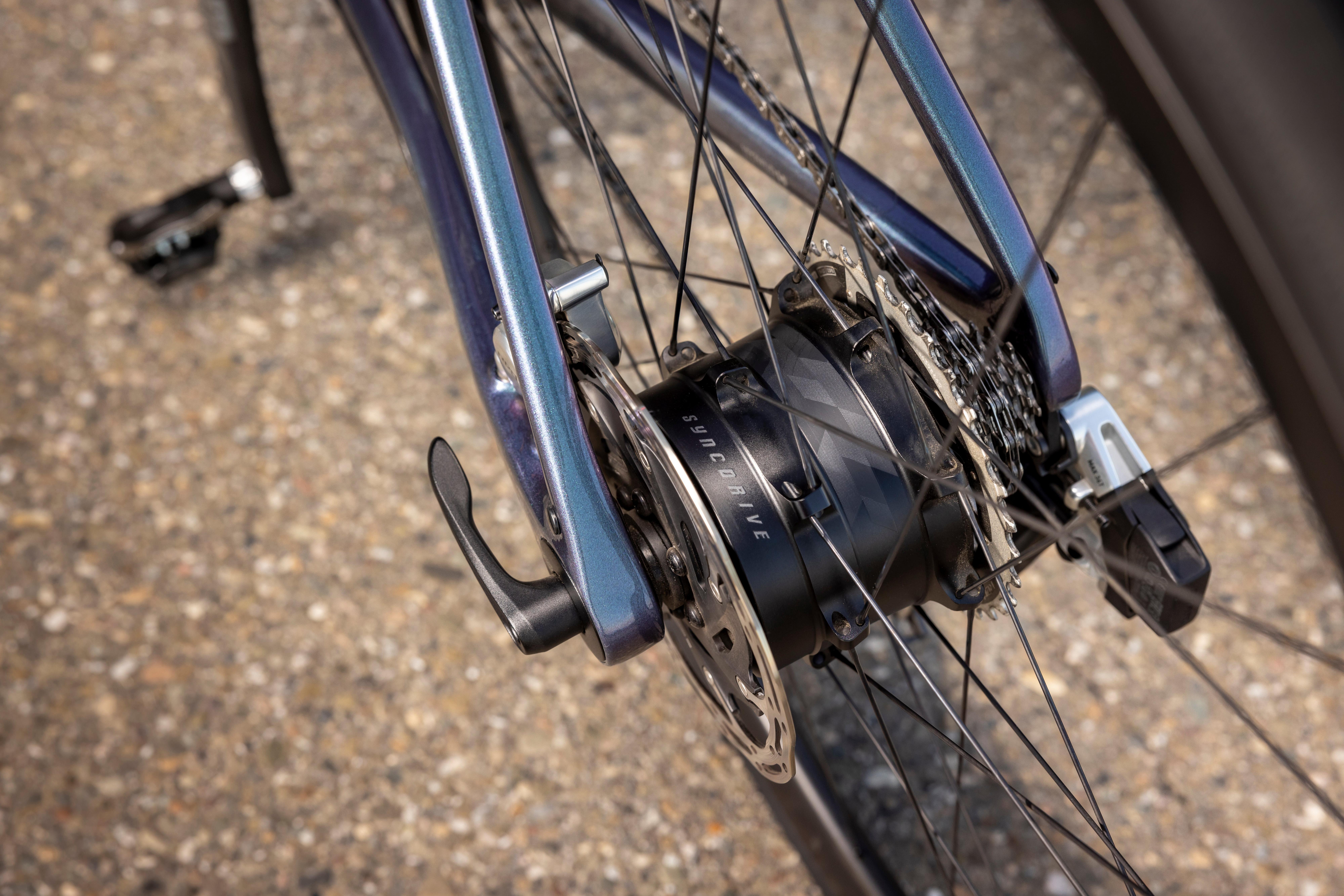 a close up of a bicycle wheel with a gear attached to it