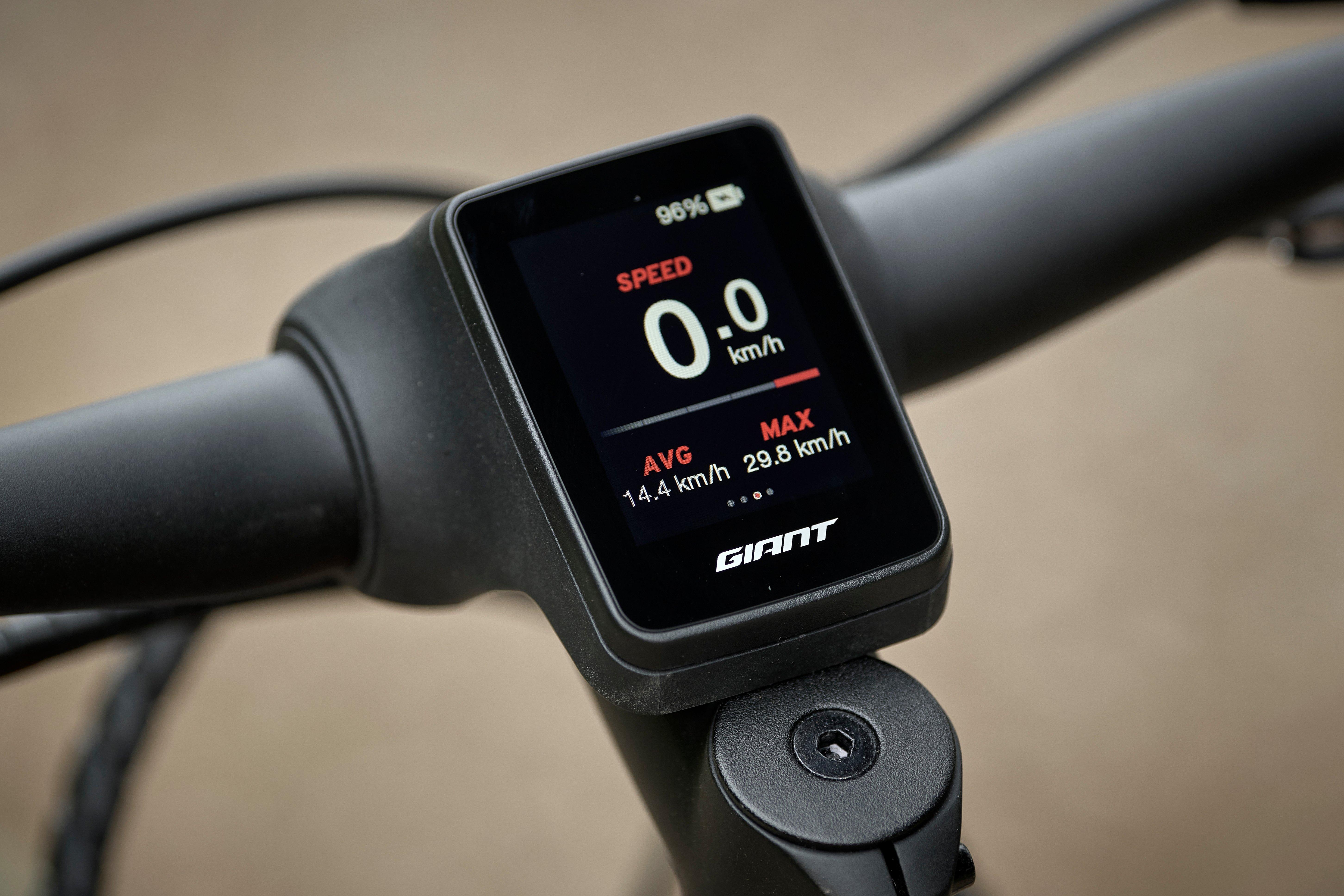 a close up of a bike's speedometer on the handlebar