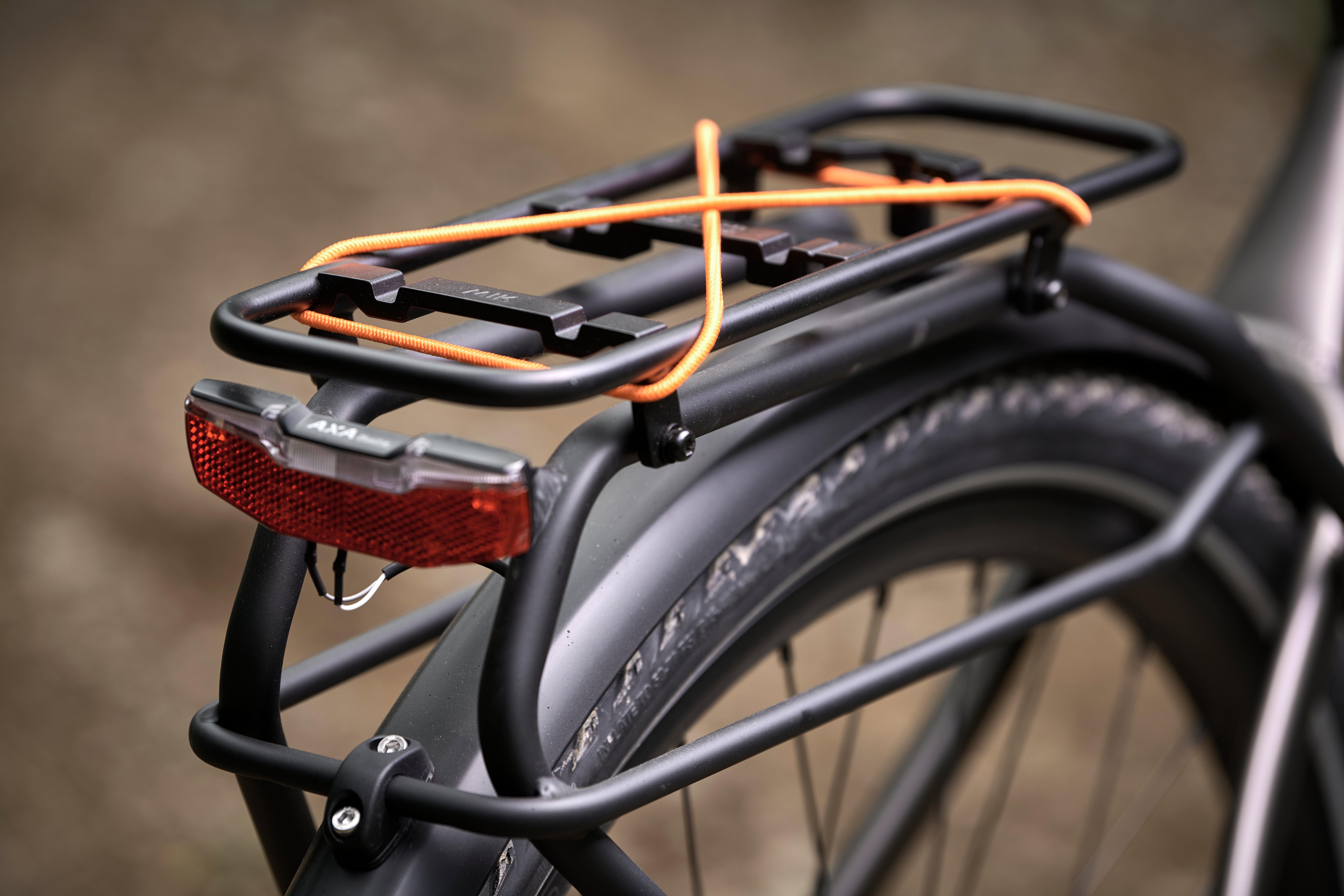 a close up of a bicycle with a rack on the back