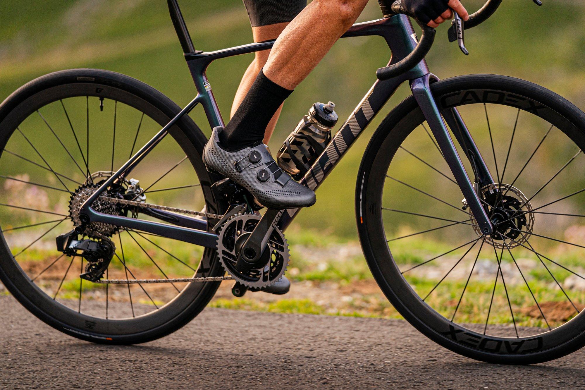 a cyclist is riding a bike on a road