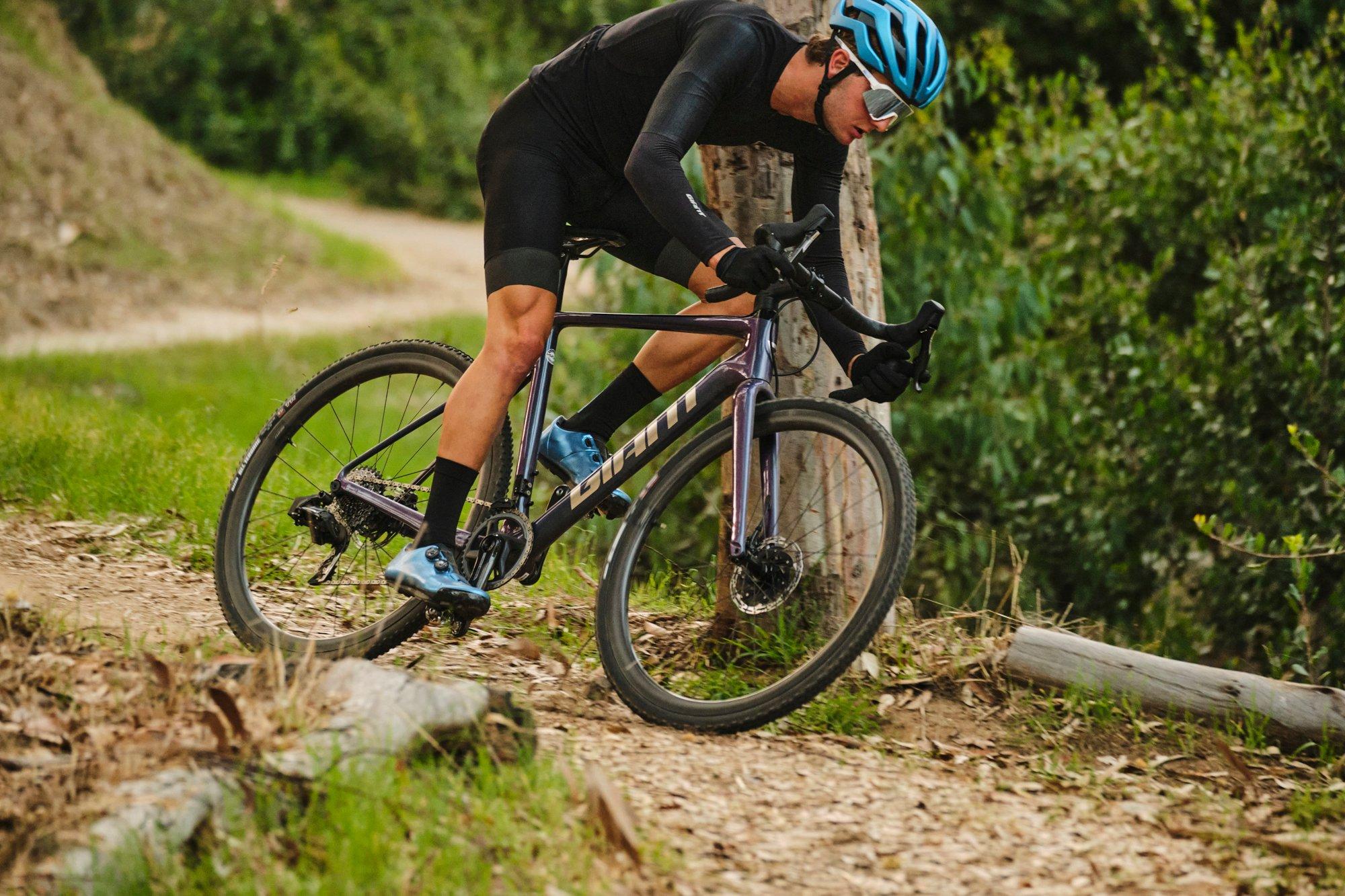 a man riding a cyclocross bike on a trail