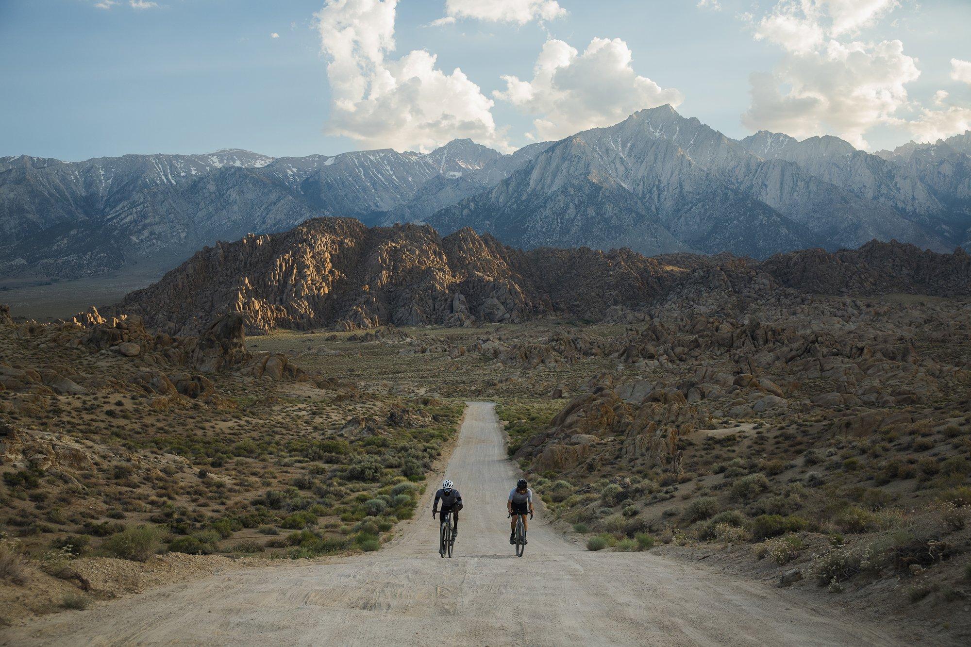 gravel riders on a long strech of dirt road