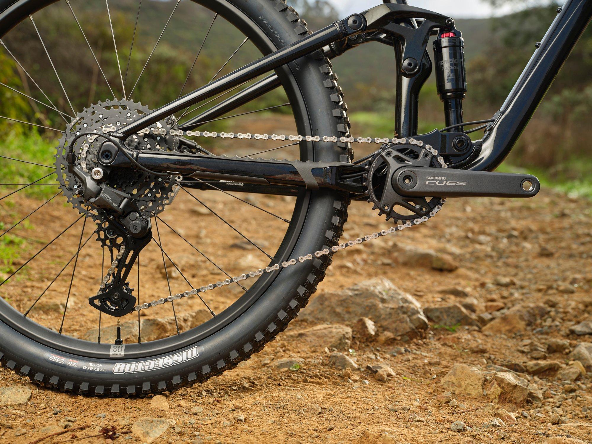 a close up of a mountain bike on a dirt road