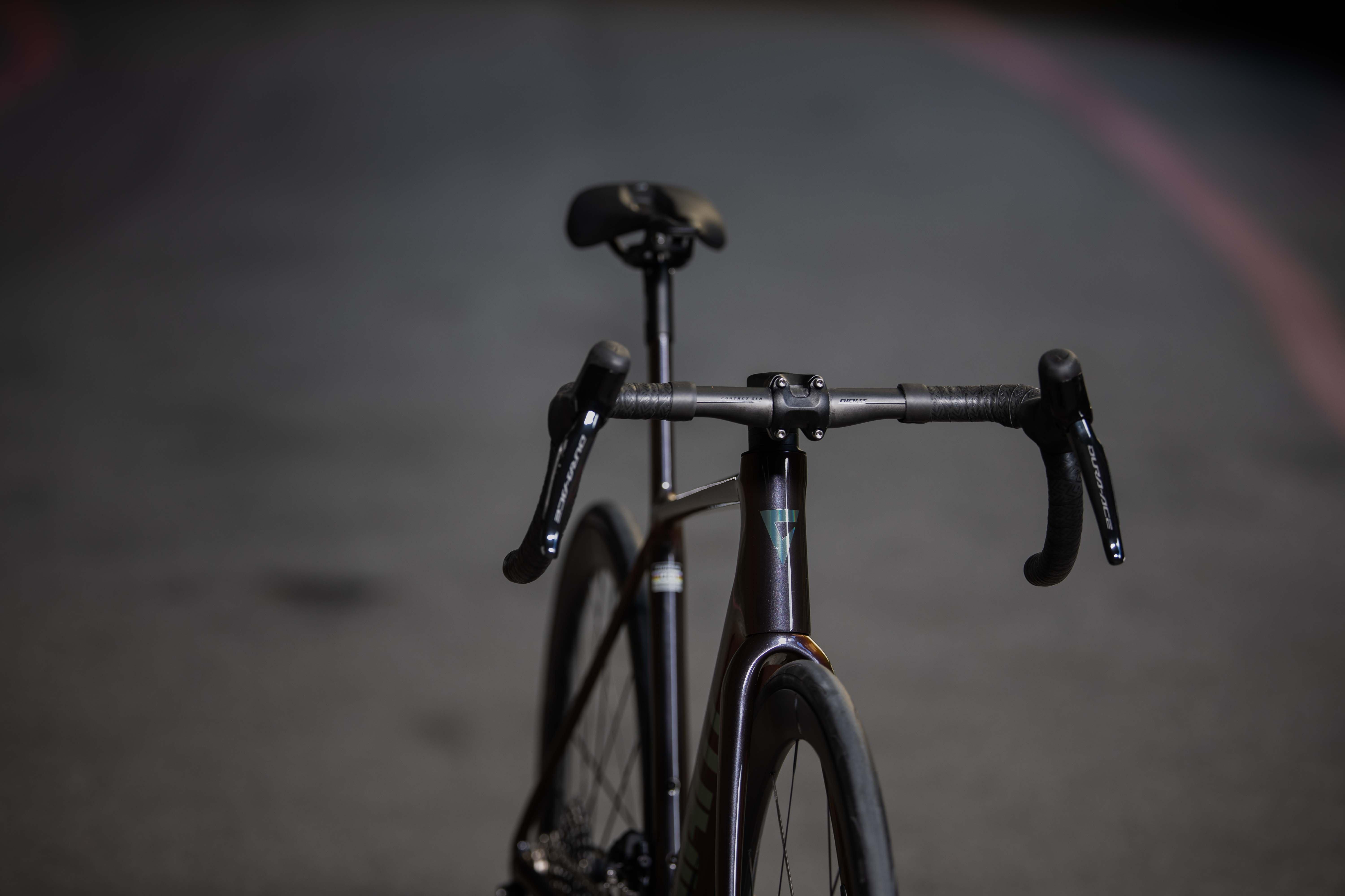 a bicycle is parked on the side of the road