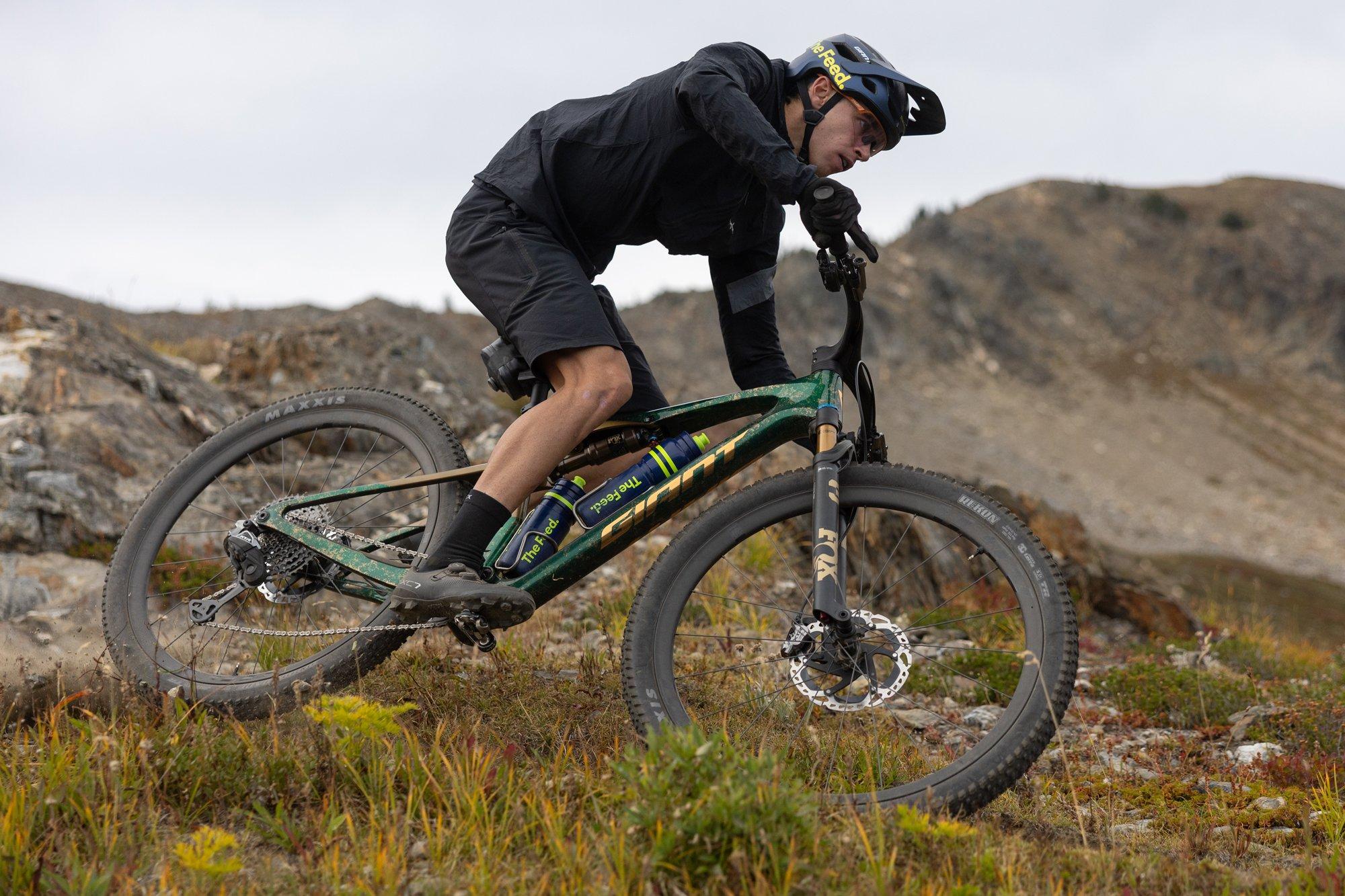a mountain bike is parked on a dirt road