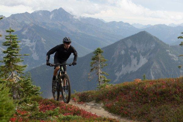 a man riding a mountain bike on a rocky trail