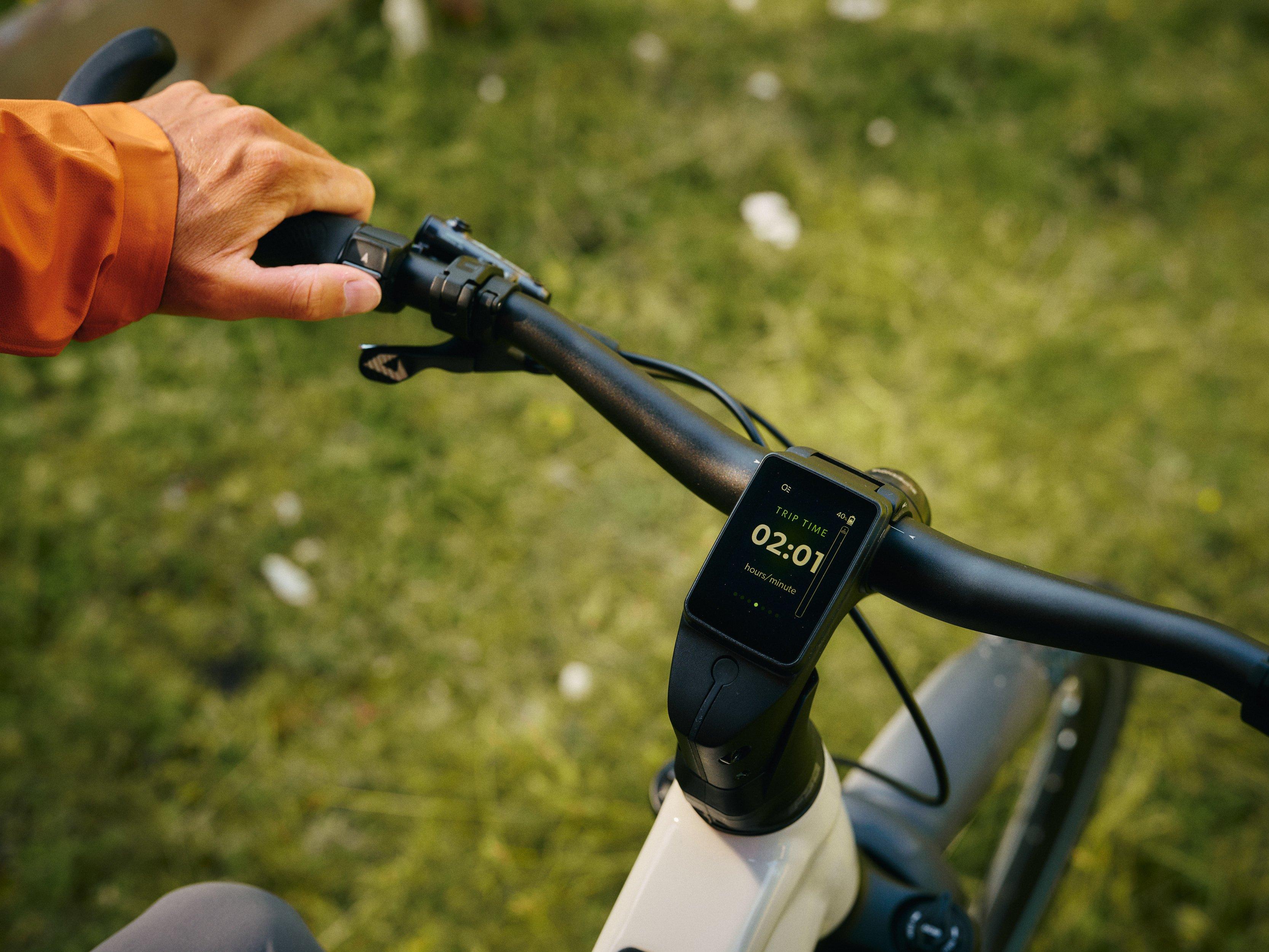 a bicycle with a handlebar and a seat on a grassy hill