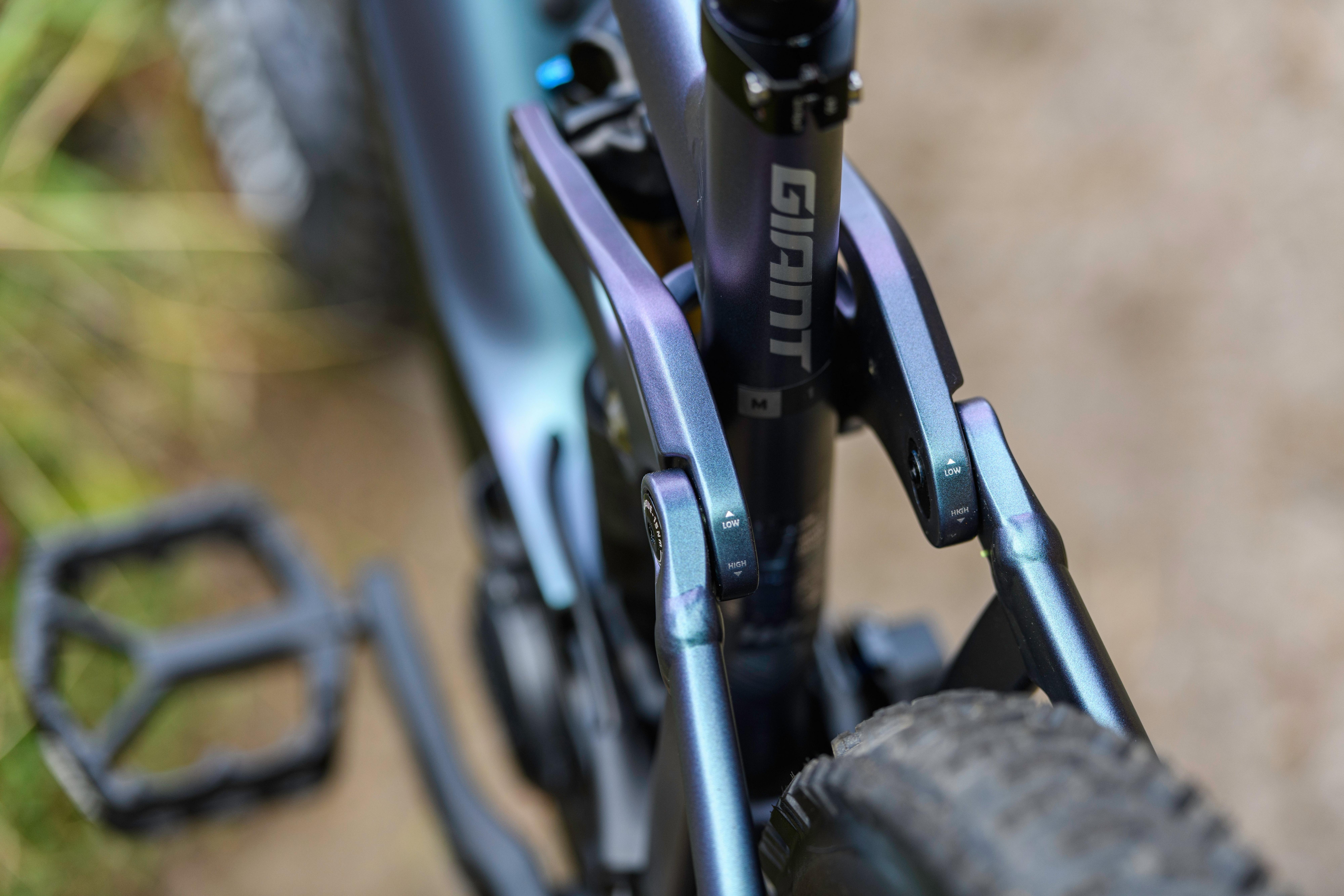 a close up of a bicycle's front wheel and pedals