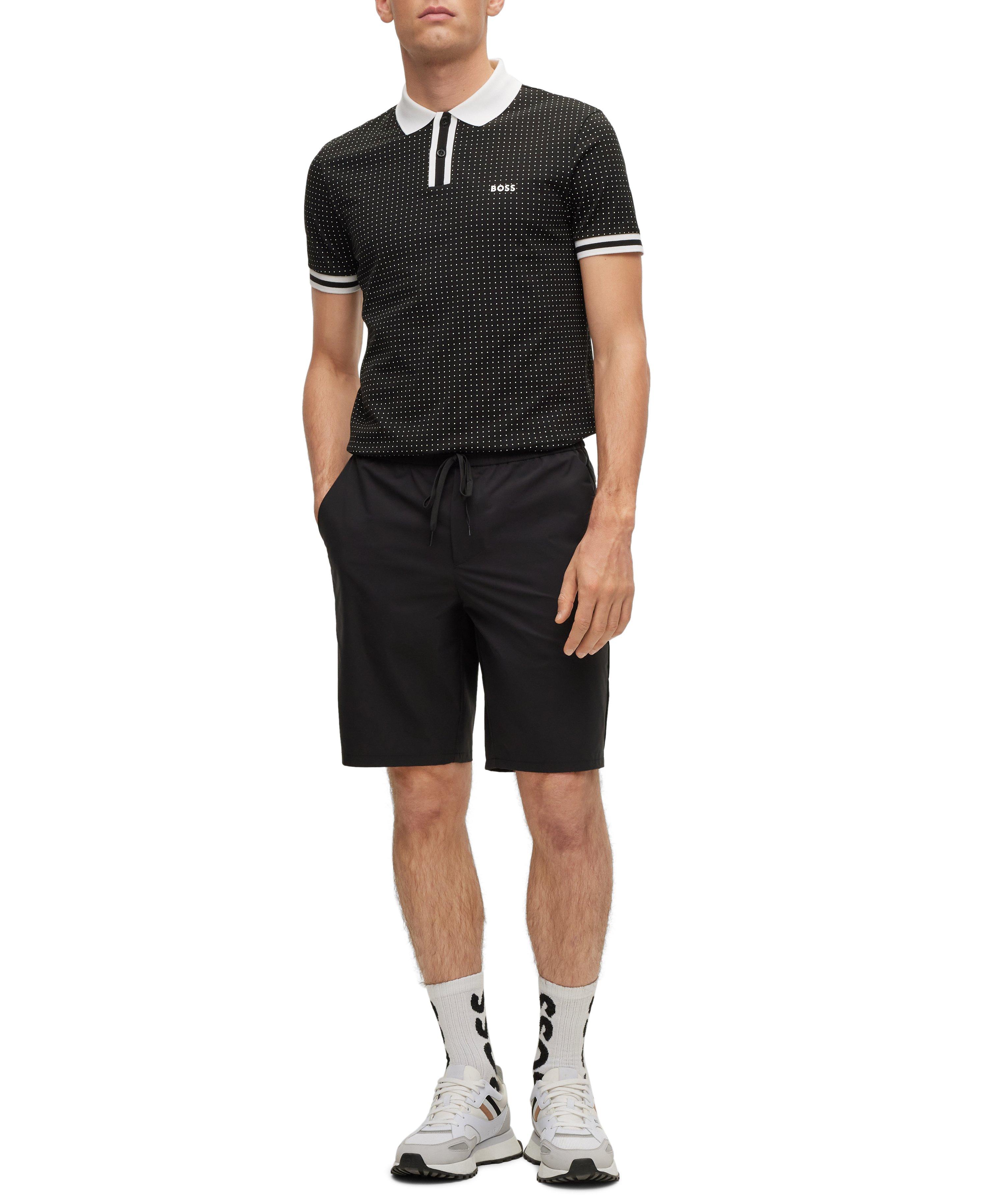 Polo en coton piqué extensible à pois image 1