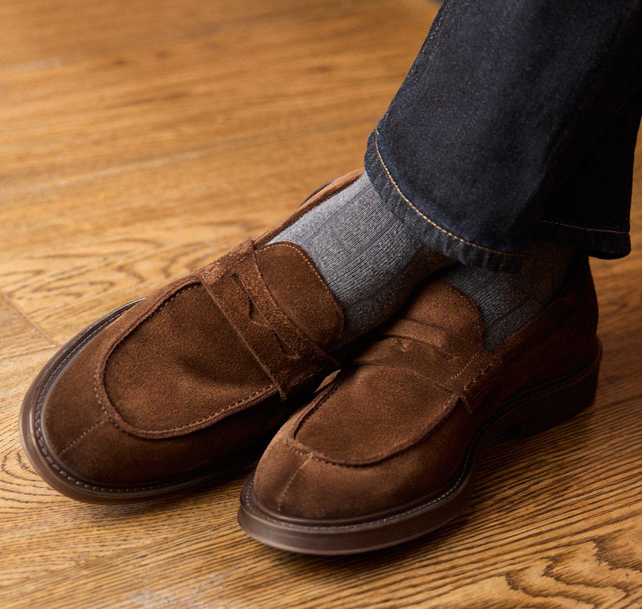 a pair of brown suede casual shoes