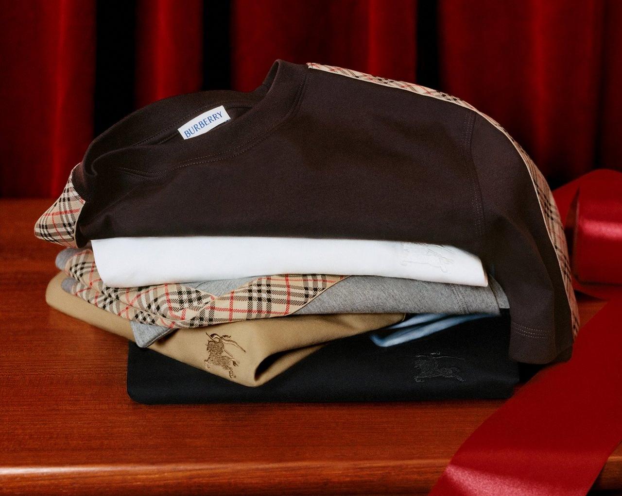 Burberry clothing displayed against a red background