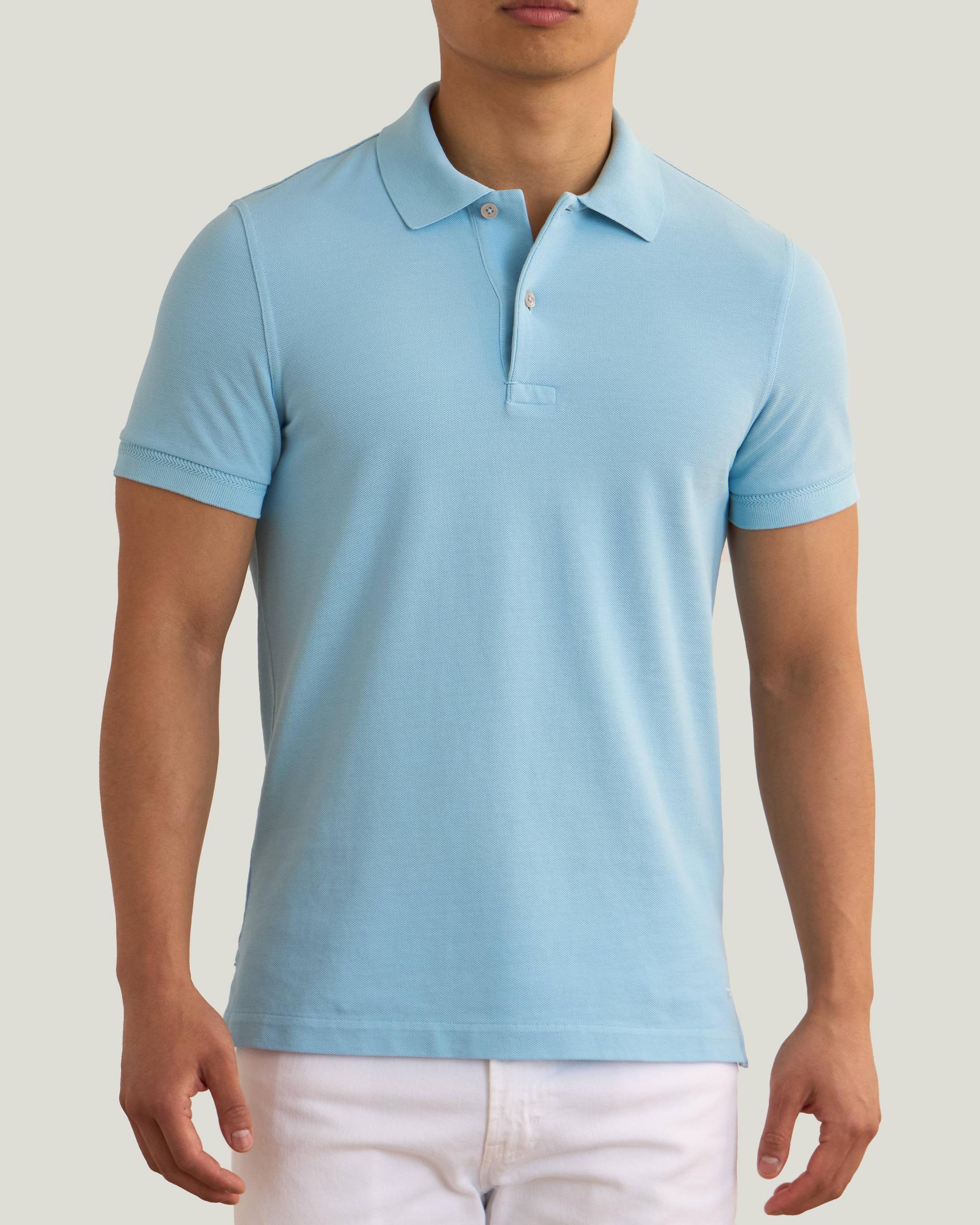 Male model wearing a sky blue TOM FORD polo
