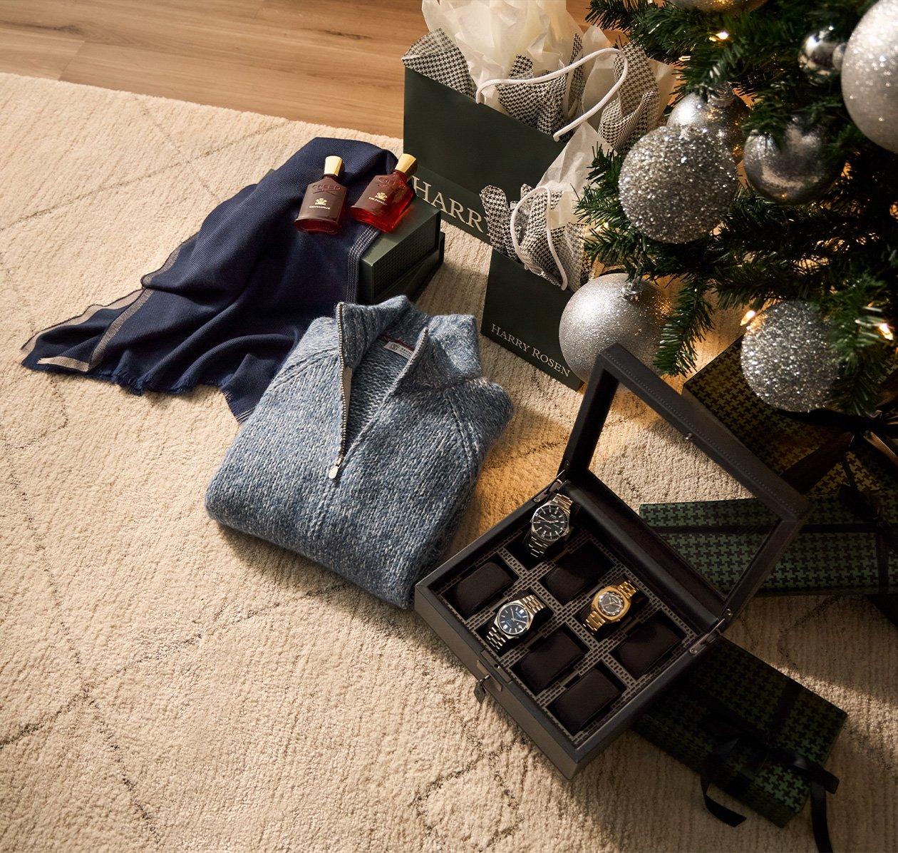 Gifts laid out under christmas tree signifying gifts for the classic gentleman