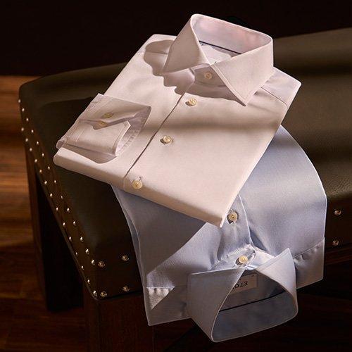 Dress shirts displayed on chair illustrating high quality essentials