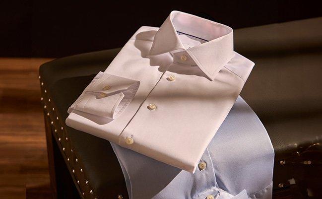 Dress shirts displayed on chair illustrating high quality essentials