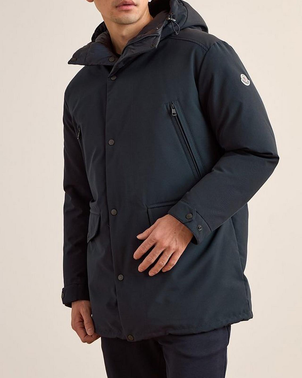 Male model wearing Moncler parka illustrating heavyweight parkas