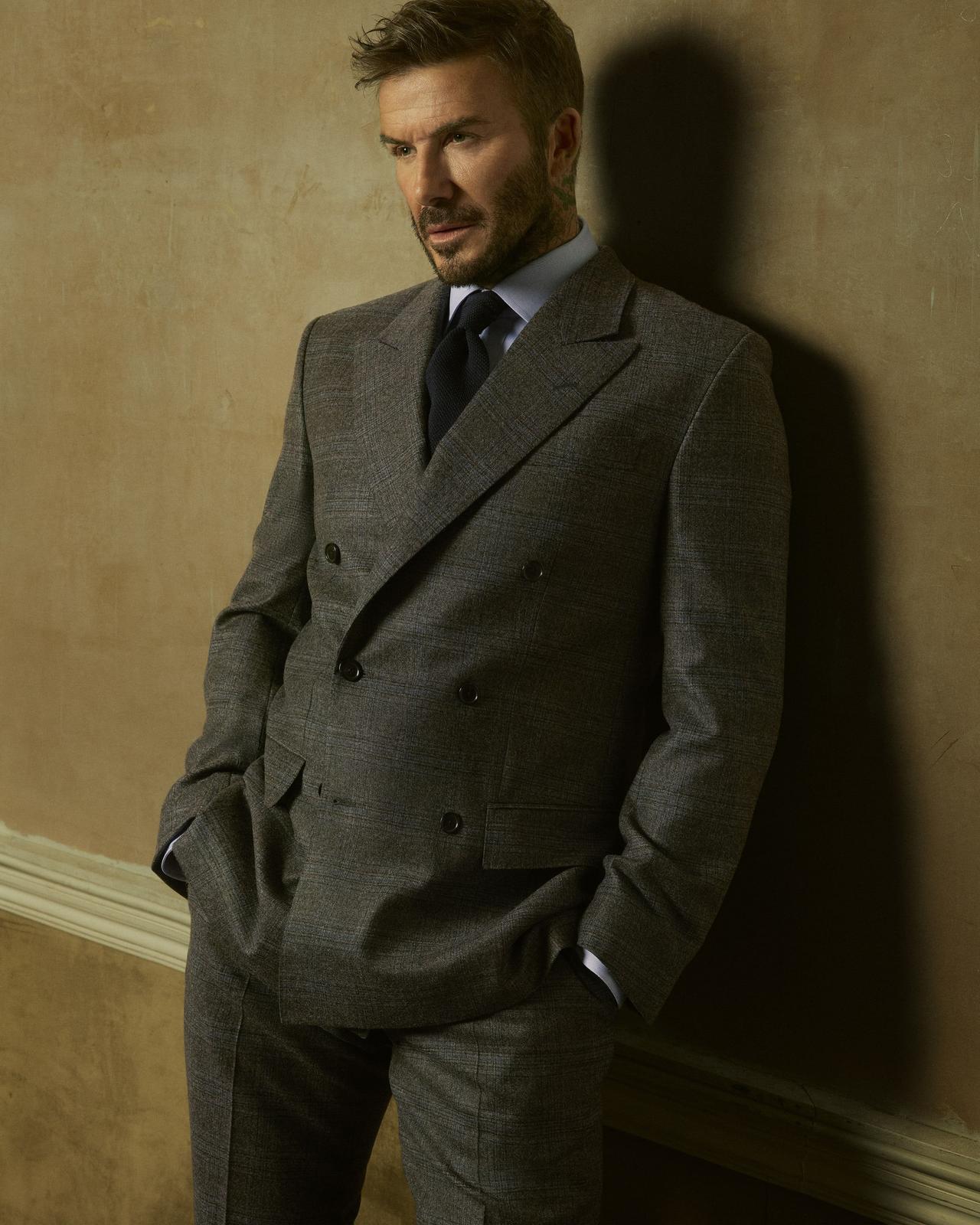 Athlete David Beckham wearing a tailored grey BECKHAM X BOSS suit