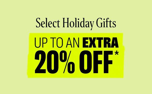 An assortment of holiday accessories and gift ideas styled on a lime green display