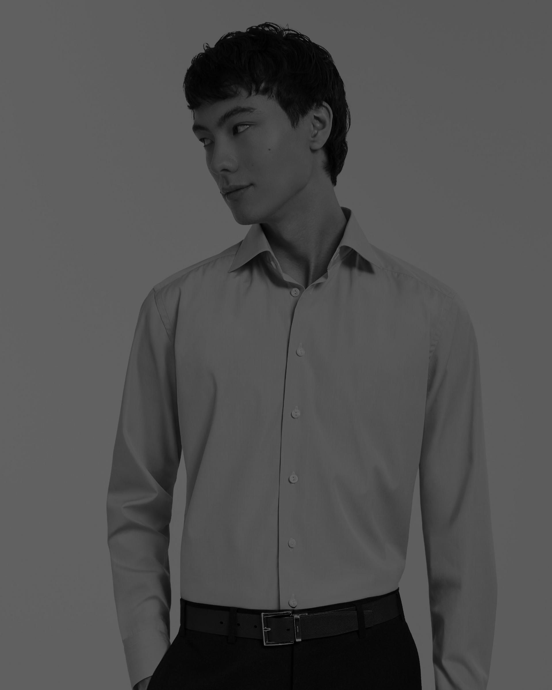 A male model wearing a black and white casual shirt