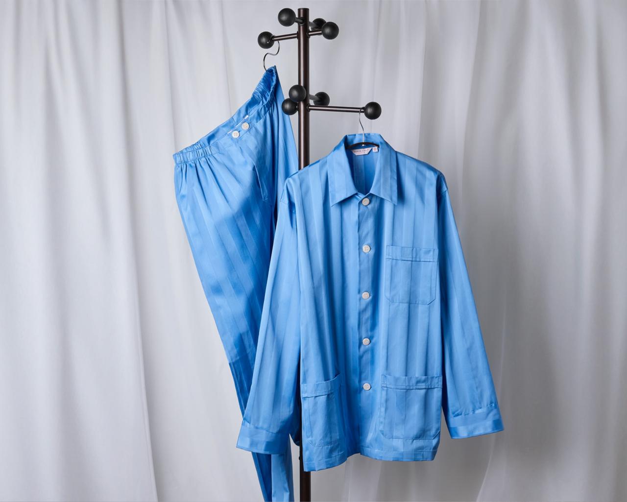 Blue Derek Rose sleepwear hanging on a hanger