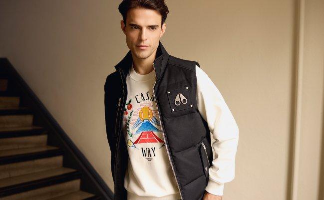 Model dressed in a casual sweater and vest