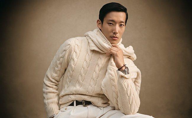 A man wearing a lightweight beige Polo Ralph Lauren sweater