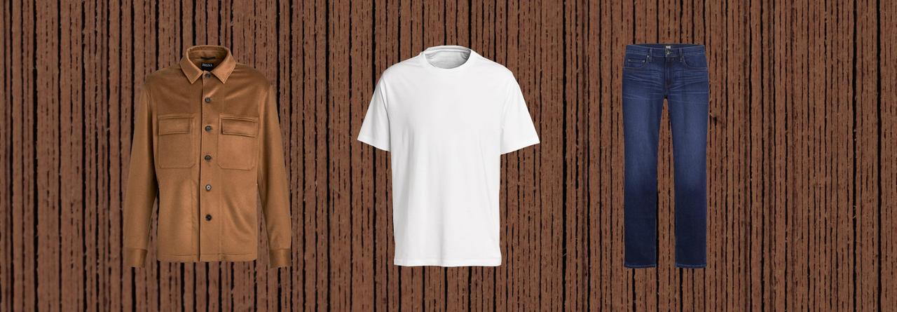 White t-shirt, blue jeans and brown shirt on the brown background