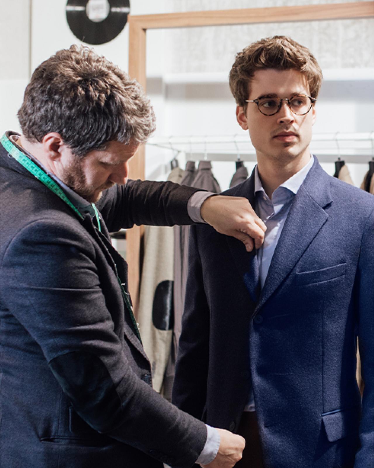 Style experts guiding customers through clothing selections at Harry Rosen