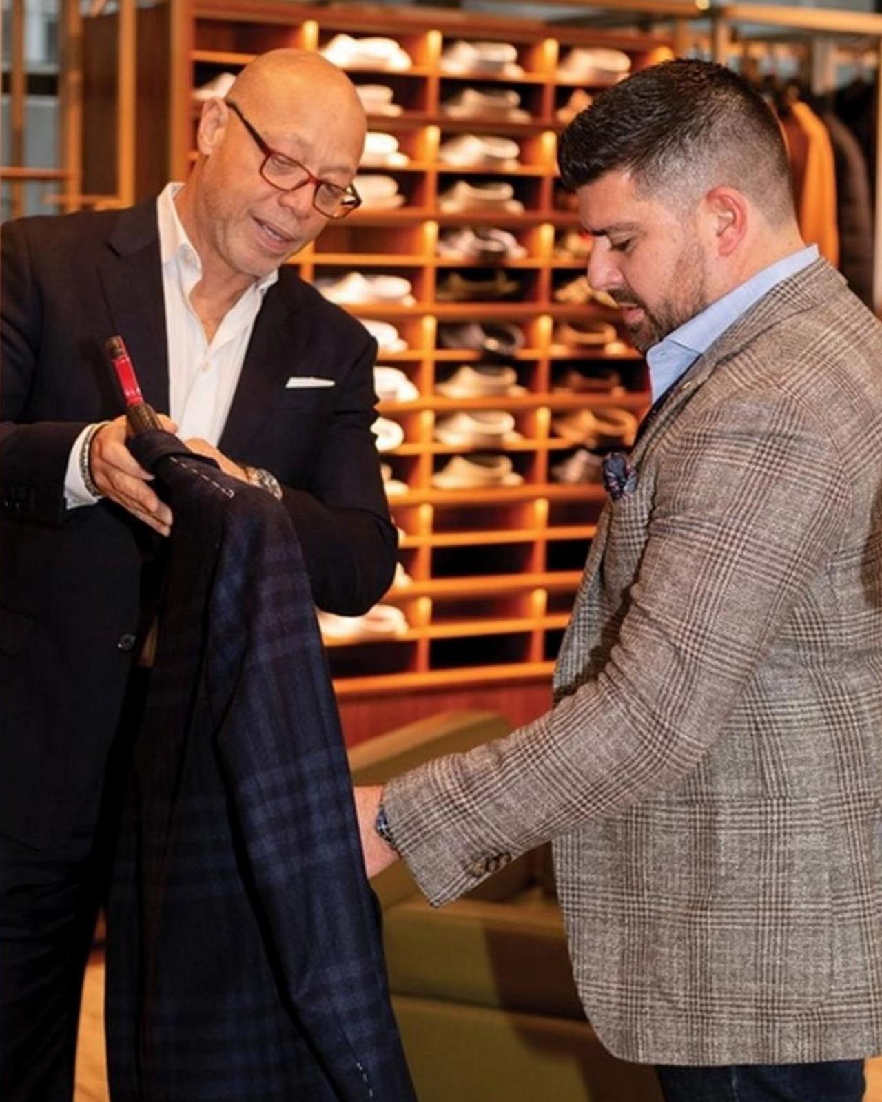 Style experts guiding customers through clothing selections at Harry Rosen