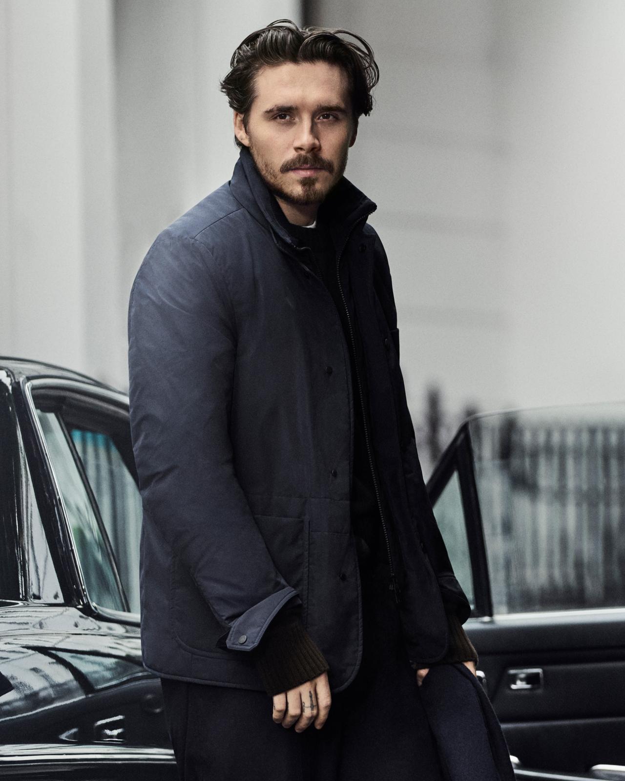 A man wearing a blue Moncler jacket