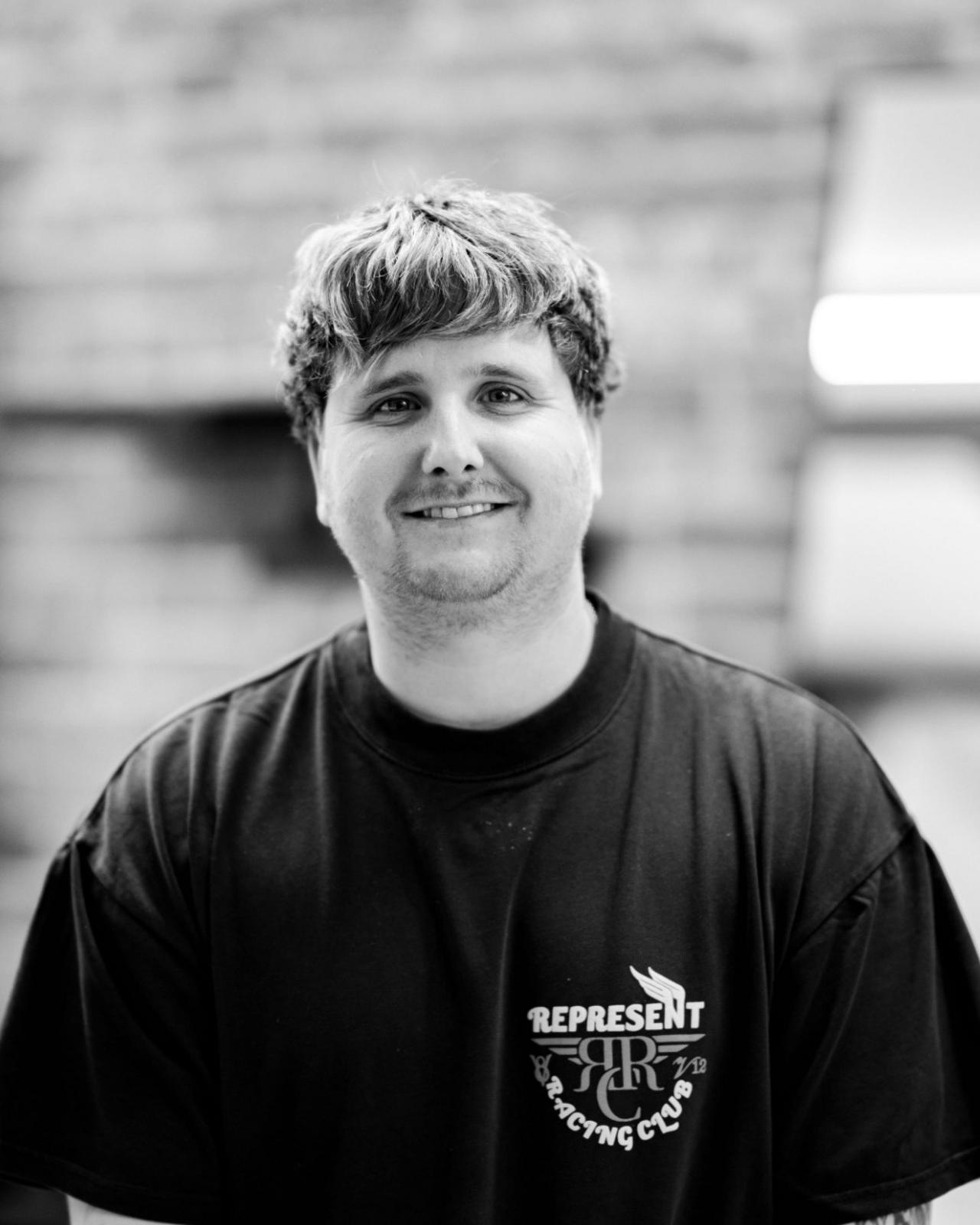 Headshot of Connor Haynes, a barber