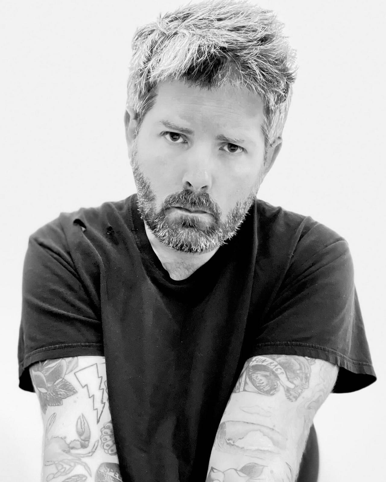 Headshot of Eric Becker, a barber