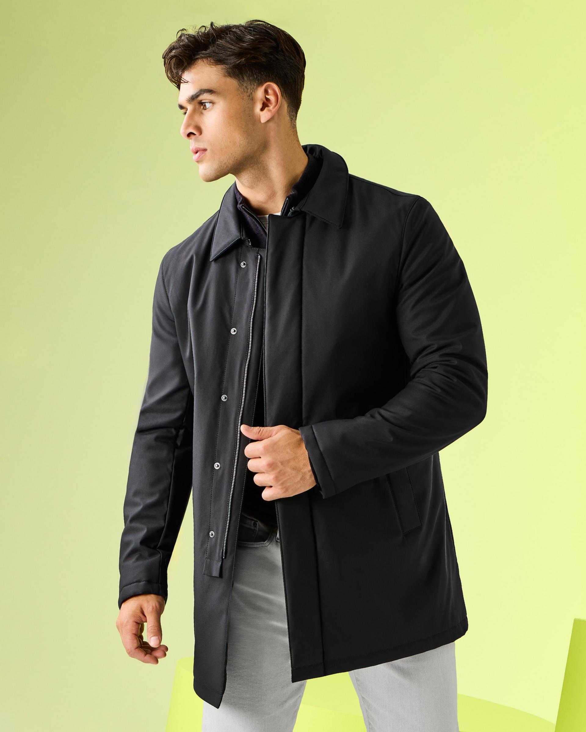 A man wearing a black coat for fall