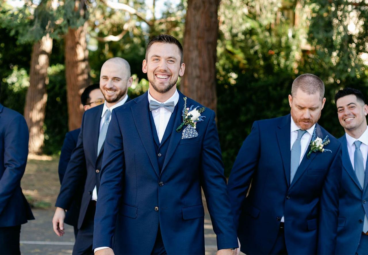 Group of males in blue suits for a wedding