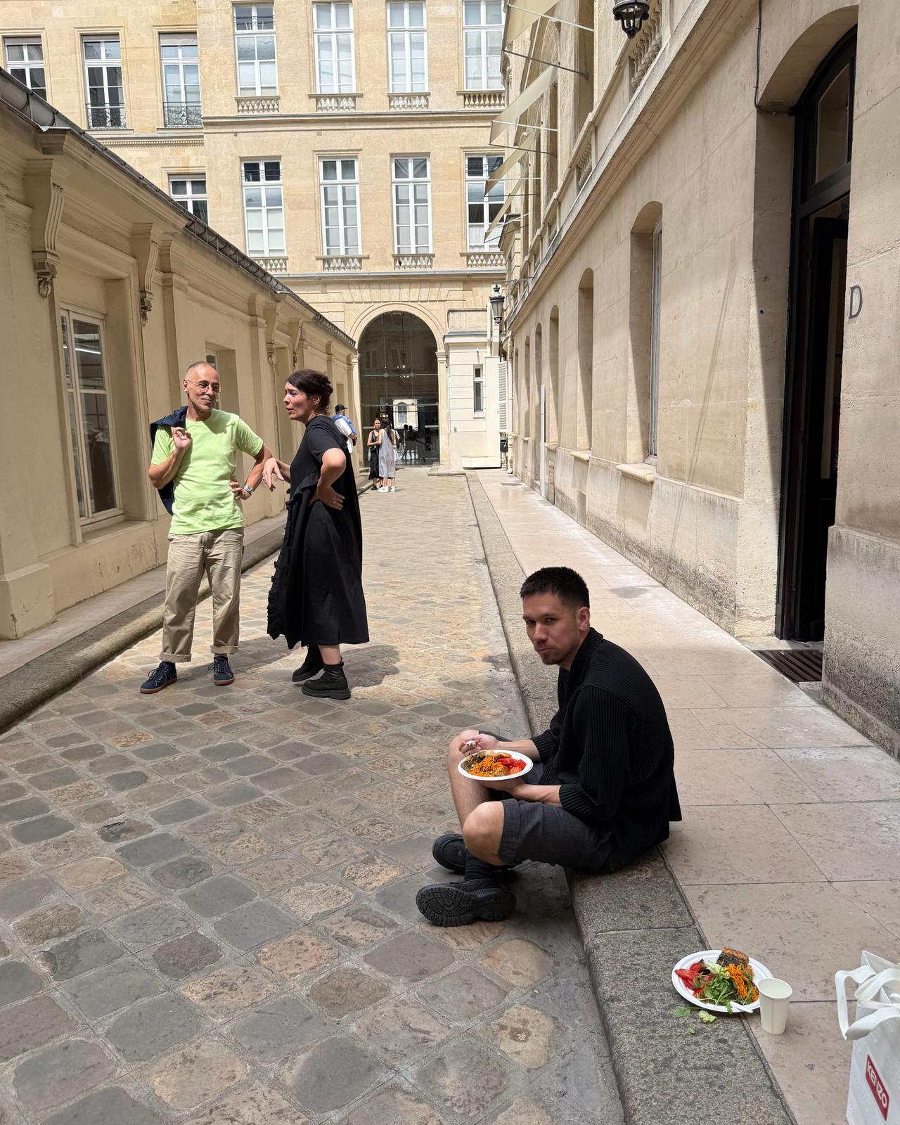 buyers sitting on the ground